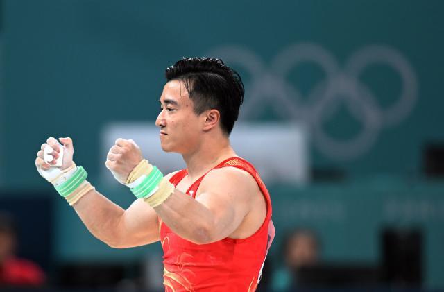 1722779901589081535.jpg AG百家乐平台-时隔三年,刘洋再次“帅气”地卫冕吊环金牌